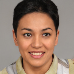 Joyful latino young-adult female with short  brown hair and brown eyes