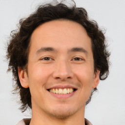 Joyful white young-adult male with medium  brown hair and brown eyes