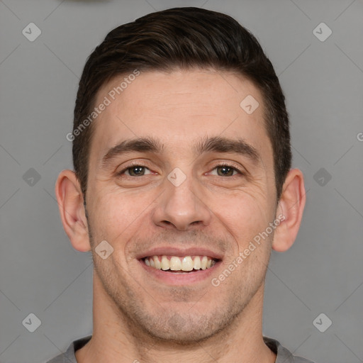 Joyful white adult male with short  brown hair and brown eyes