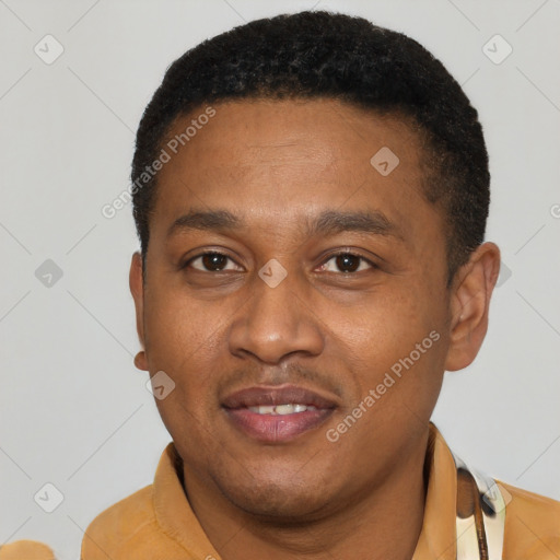 Joyful latino young-adult male with short  black hair and brown eyes