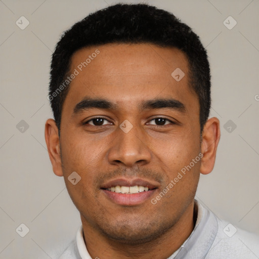 Joyful latino young-adult male with short  black hair and brown eyes
