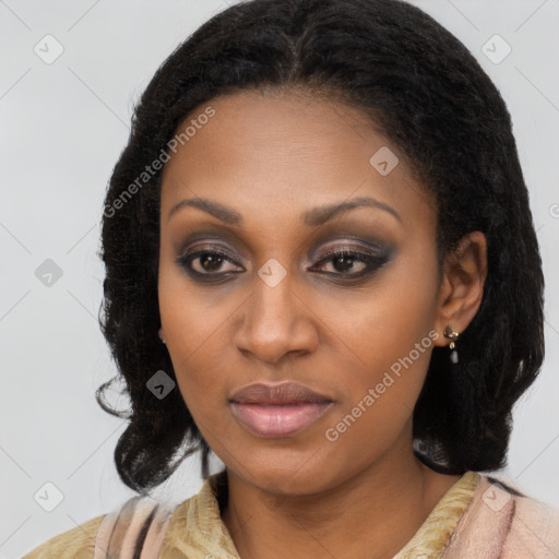 Joyful black young-adult female with medium  brown hair and brown eyes