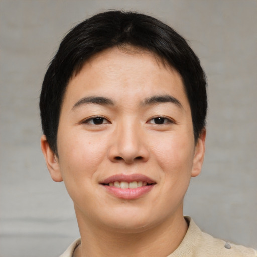 Joyful asian young-adult female with short  brown hair and brown eyes