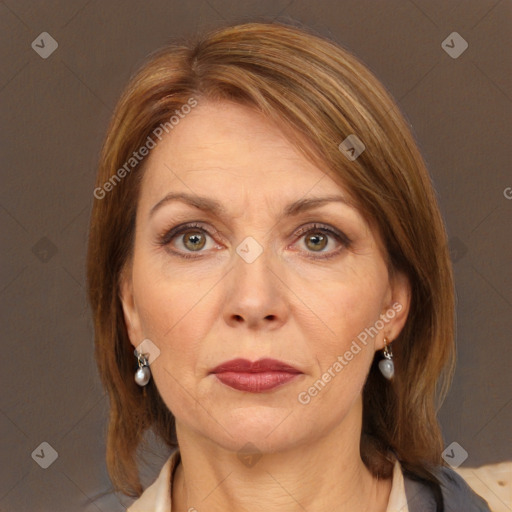 Joyful white adult female with medium  brown hair and brown eyes