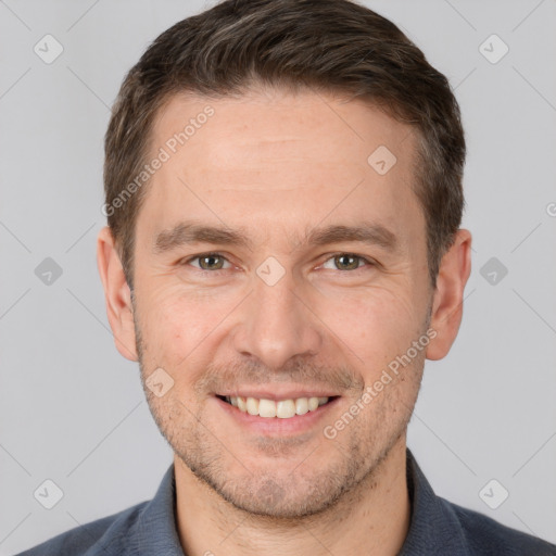 Joyful white adult male with short  brown hair and brown eyes