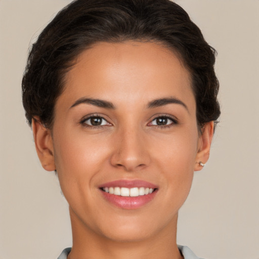 Joyful white young-adult female with short  brown hair and brown eyes