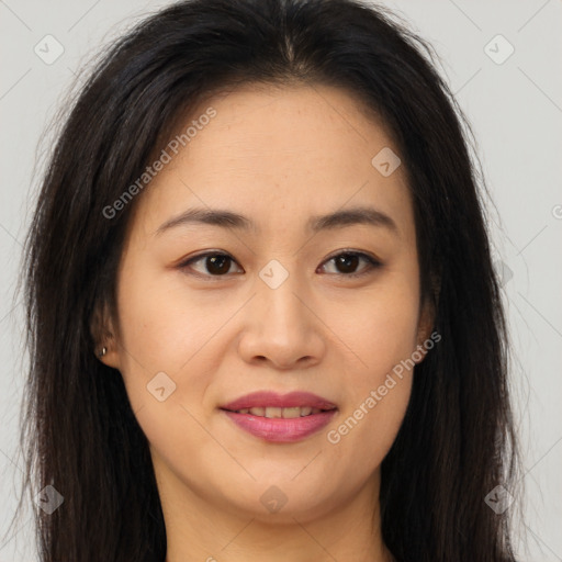 Joyful asian young-adult female with long  brown hair and brown eyes