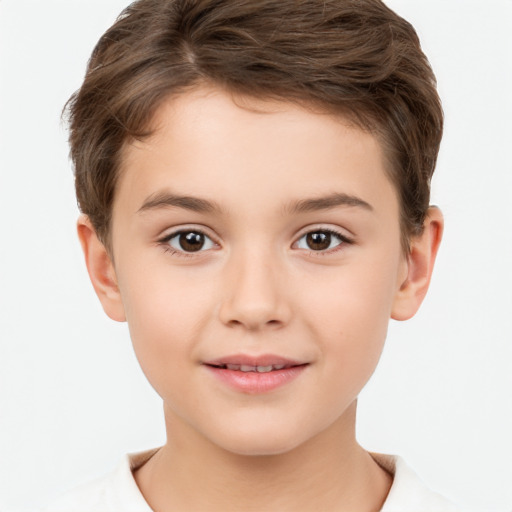 Joyful white child male with short  brown hair and brown eyes