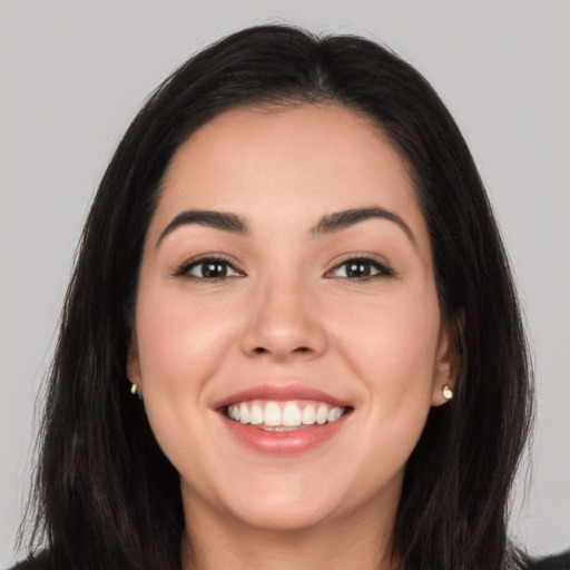 Joyful white young-adult female with long  black hair and brown eyes