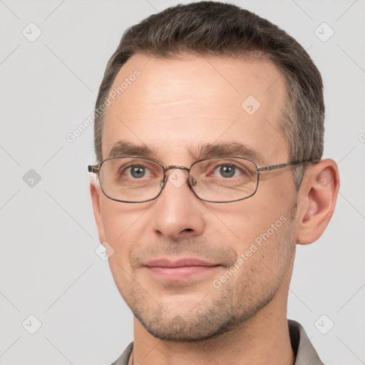 Joyful white adult male with short  brown hair and brown eyes