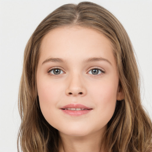 Joyful white child female with long  brown hair and brown eyes