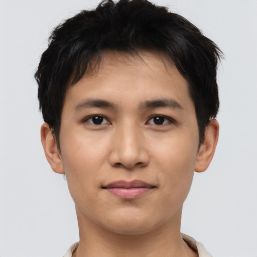 Joyful asian young-adult male with short  black hair and brown eyes
