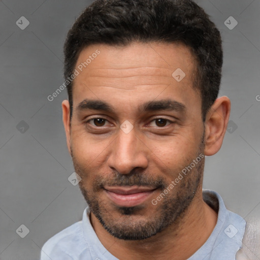 Joyful white young-adult male with short  black hair and brown eyes