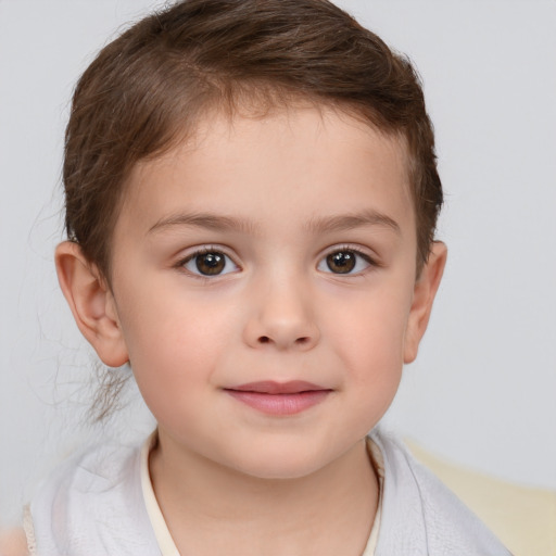 Joyful white child male with short  brown hair and brown eyes