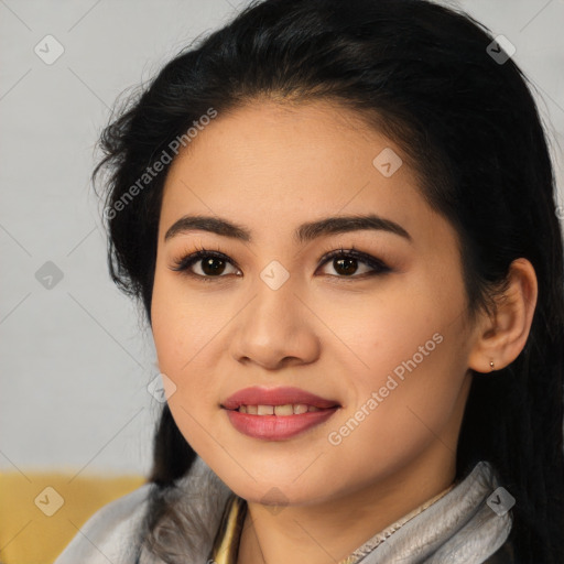 Joyful latino young-adult female with long  black hair and brown eyes