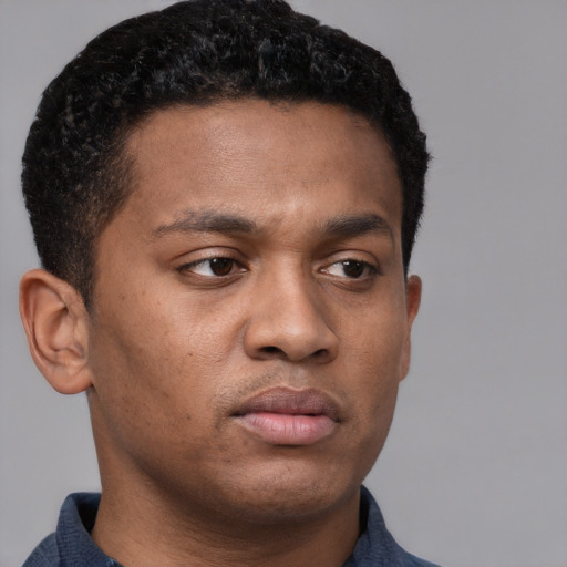 Neutral latino young-adult male with short  brown hair and brown eyes