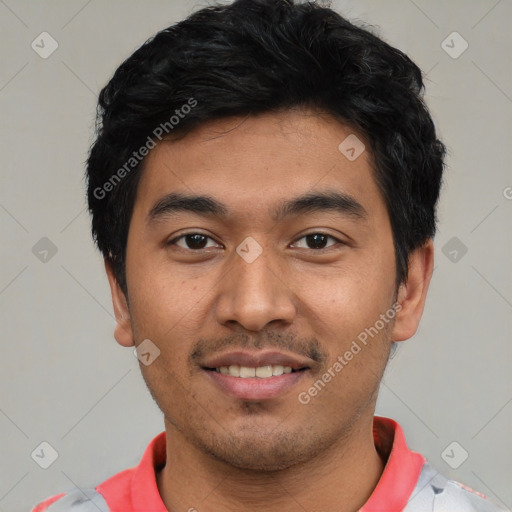 Joyful white young-adult male with short  black hair and brown eyes