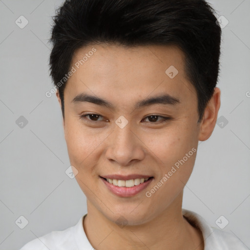 Joyful asian young-adult male with short  brown hair and brown eyes