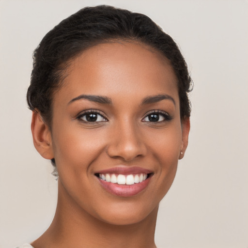 Joyful latino young-adult female with short  brown hair and brown eyes