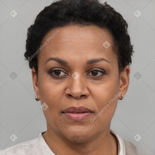 Joyful black adult female with short  brown hair and brown eyes