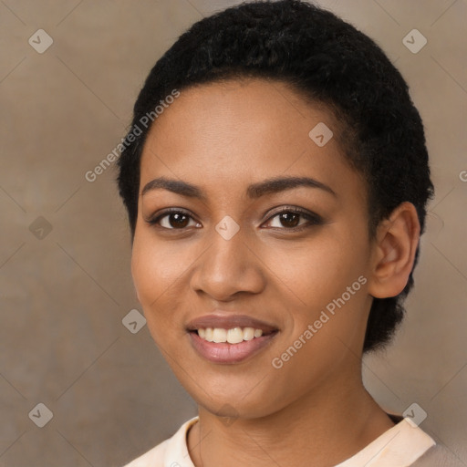 Joyful black young-adult female with short  black hair and brown eyes