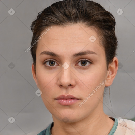 Neutral white young-adult female with short  brown hair and brown eyes