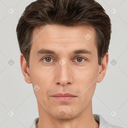 Neutral white young-adult male with short  brown hair and brown eyes