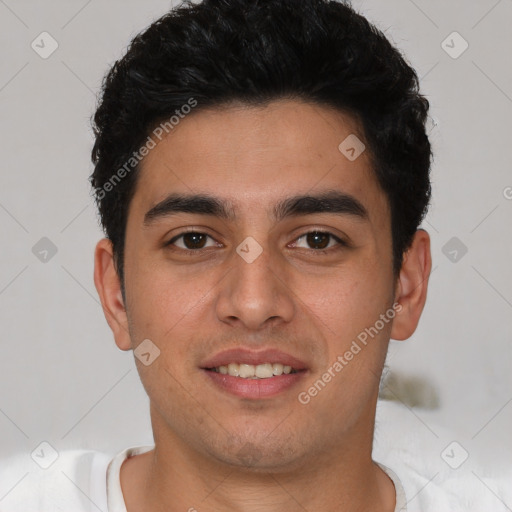 Joyful white young-adult male with short  black hair and brown eyes