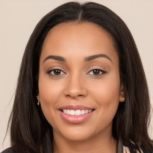 Joyful white young-adult female with long  brown hair and brown eyes