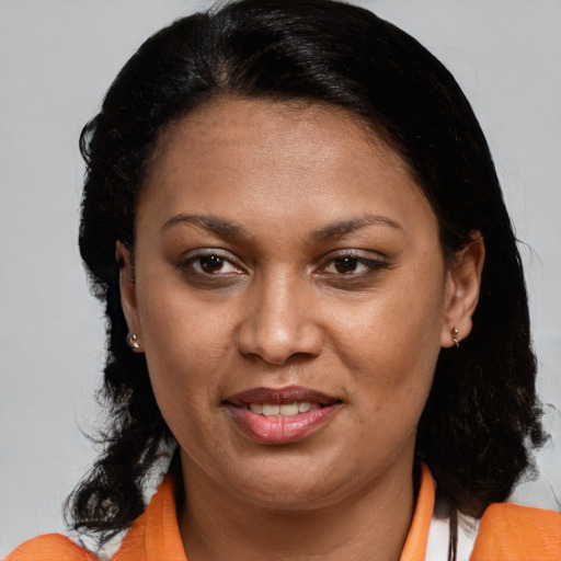 Joyful black young-adult female with medium  brown hair and brown eyes