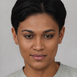Joyful asian young-adult female with short  black hair and brown eyes