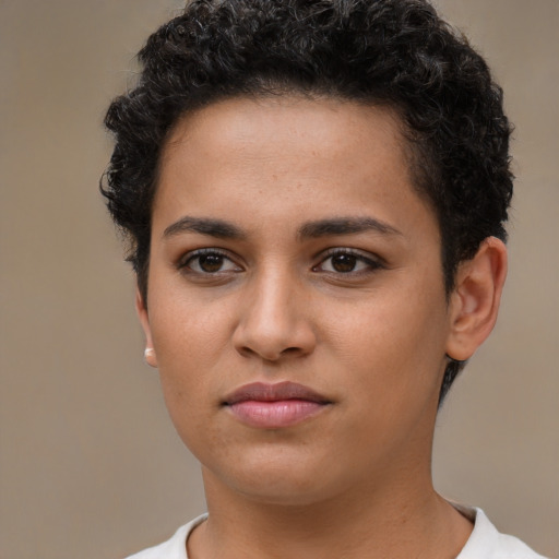 Joyful latino young-adult female with short  brown hair and brown eyes