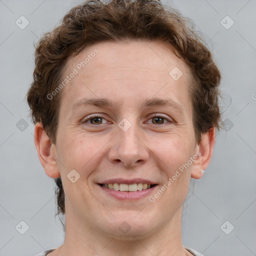 Joyful white adult female with short  brown hair and grey eyes