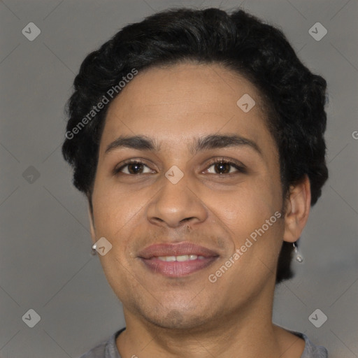 Joyful latino young-adult male with short  brown hair and brown eyes