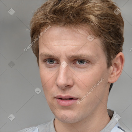 Joyful white adult male with short  brown hair and grey eyes