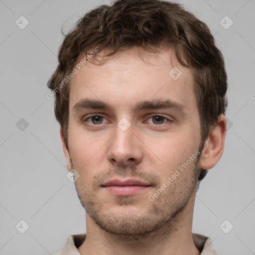 Neutral white young-adult male with short  brown hair and grey eyes