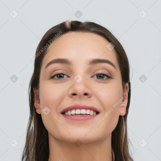 Joyful white young-adult female with long  brown hair and grey eyes