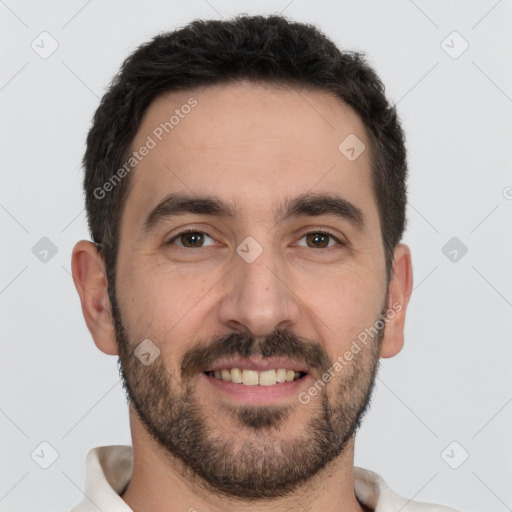 Joyful white young-adult male with short  black hair and brown eyes