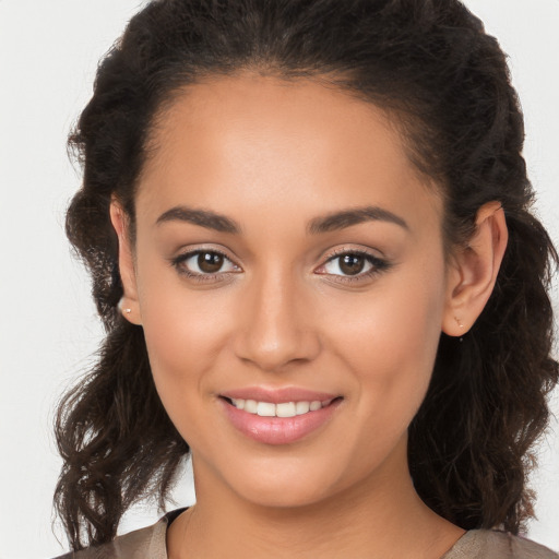 Joyful white young-adult female with long  brown hair and brown eyes