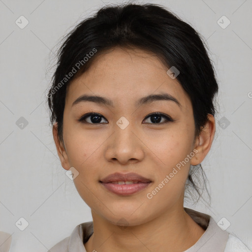 Joyful asian young-adult female with short  brown hair and brown eyes