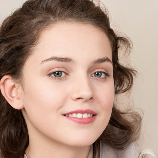 Joyful white young-adult female with long  brown hair and blue eyes