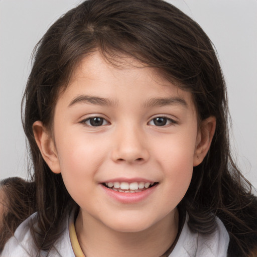 Joyful white child female with medium  brown hair and brown eyes