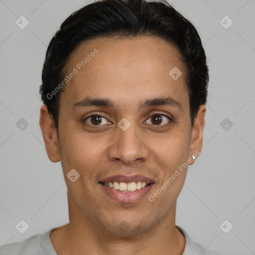 Joyful latino young-adult male with short  brown hair and brown eyes