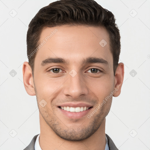 Joyful white young-adult male with short  brown hair and brown eyes