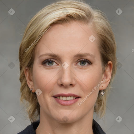 Joyful white adult female with medium  brown hair and blue eyes