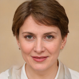 Joyful white adult female with medium  brown hair and grey eyes