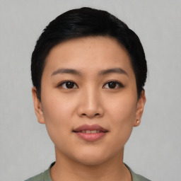 Joyful asian young-adult female with short  black hair and brown eyes