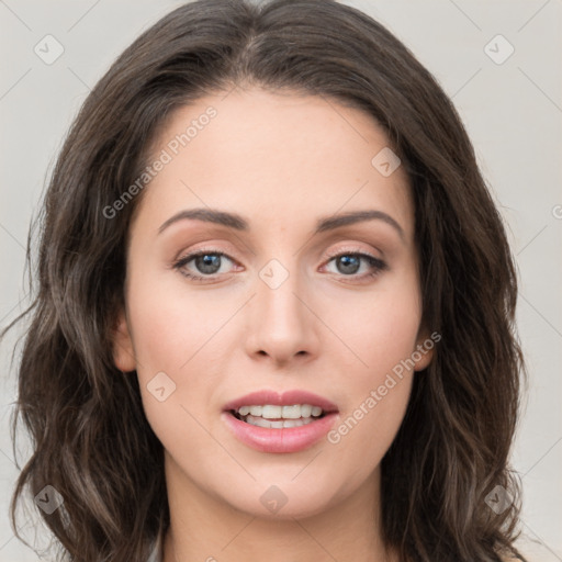 Joyful white young-adult female with long  brown hair and green eyes