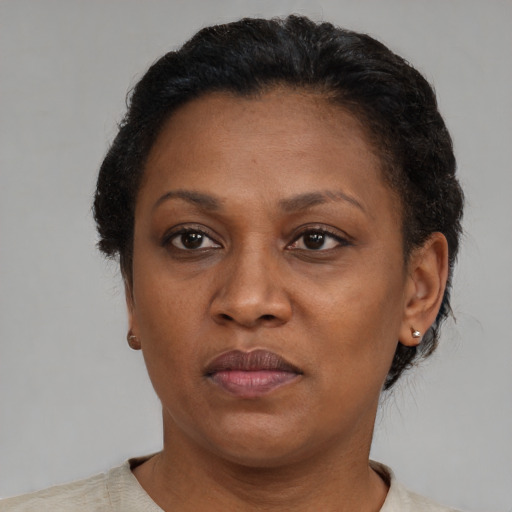 Neutral black adult female with short  brown hair and brown eyes