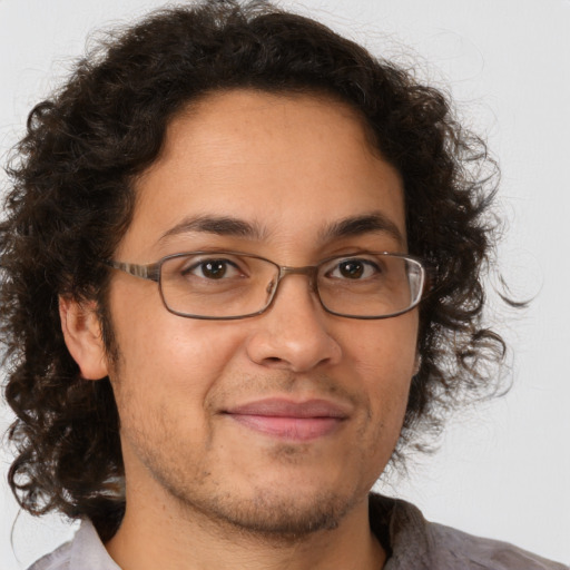 Joyful white adult male with medium  brown hair and brown eyes